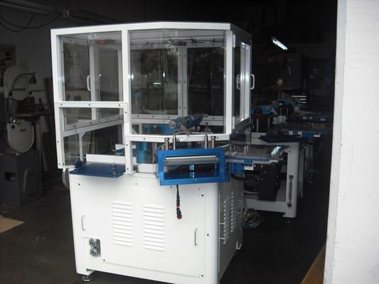 Complete Automated Cap Lining Machine.