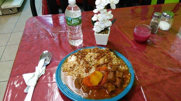 Beef Stew with dice potatoes and dice carrots and with white rice and kidney beans gravy with some beans...