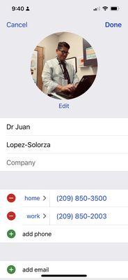 Dr in exam room with patient and information