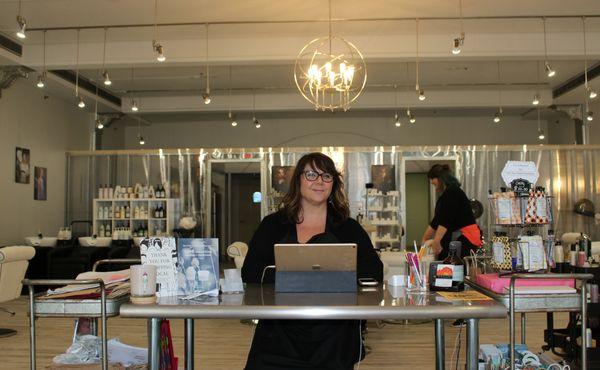 The owner and view of the entrance to the salon