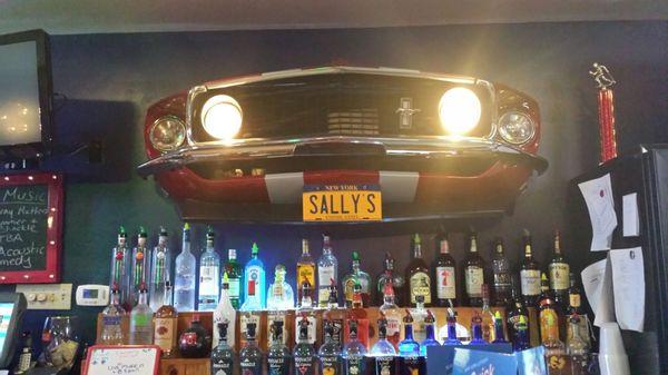Cool Mustang over bar! Love their fun bar decor.