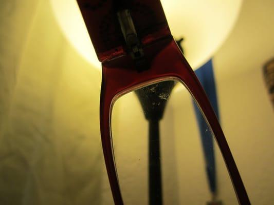 Scratched lens from drilling my glasses back together. The frames were superglued back together.