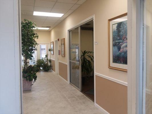 As you walk into building, there will be two sets of doors, go through and office on the left side