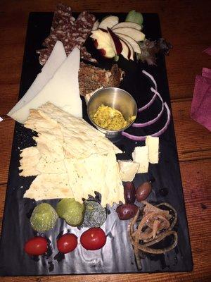 Charcuterie comes with 3 item choices cheeses meats, then extra for each added item. This photo is 4 items