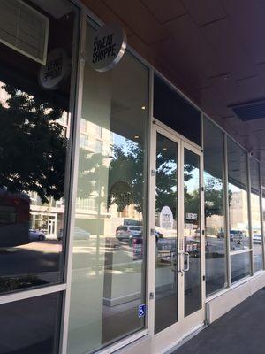 On Los Angeles St right next door to Club Pilates