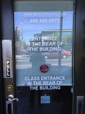 The door on El Camino lets students know that the entrance to the studio is in the rear of the building.