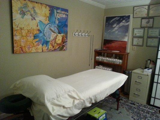 My acupuncture office complete with compounding Chinese Herbal pharmacy for individualized formulas.  A heated massage table and paintings.