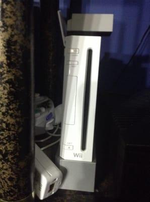 Nintendo wii with controller and wires