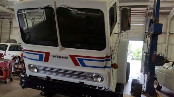 Working on/repairing the first truck that Corley Wetsel used for business in 196(4)? Display truck now.