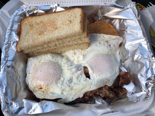 Corned beef hash platter with two eggs over easy, hash browns, toast!