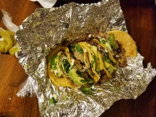 Mini tacos de fajita w carmelized onion cilantro and avocado slice. Oh n they give you pico de gallo and salsa verde in baggies very spicy!