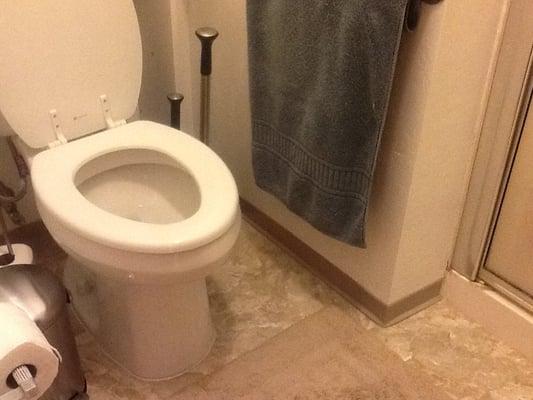 Here's a tiny master bath after installation by Marvin and his son Paul of engineered stone by Armstrong.