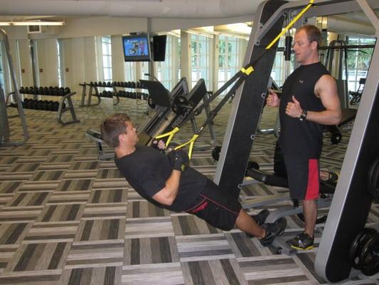A client performing a TRX row. Variety is important to getting results as well as keeping things interesting and fun.