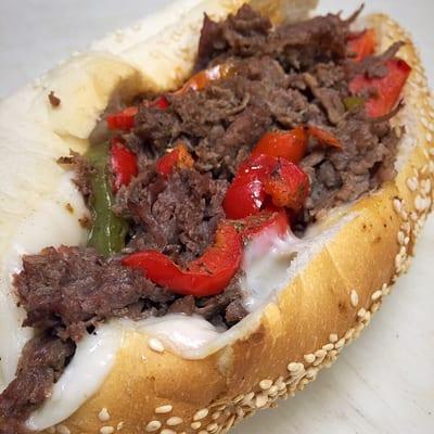 Pepper steak sub with toasted bread.