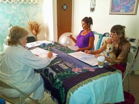 Learning the Reiki power symbols in Reiki 2 class.