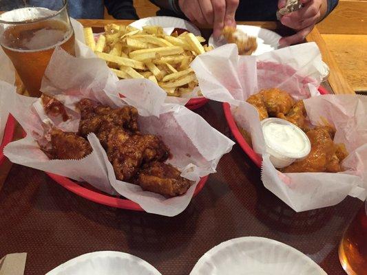 Sticky Asian wings on the left Jameson wings on the right soooo yummy