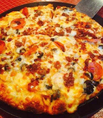 Buffalo chicken pizza plus black olives, bacon and pepperoni!!