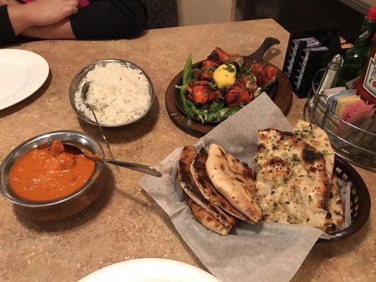 Butter chicken, rice, Tandoori Chicken, and 2 types of naan (special naan and garlic naan)