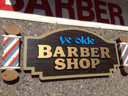 Ye olde sign in front of ye olde Barber Shop