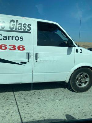 Look at this company with illegal tint on their passenger window.