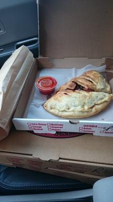 Spinach and pepperoni calzone.