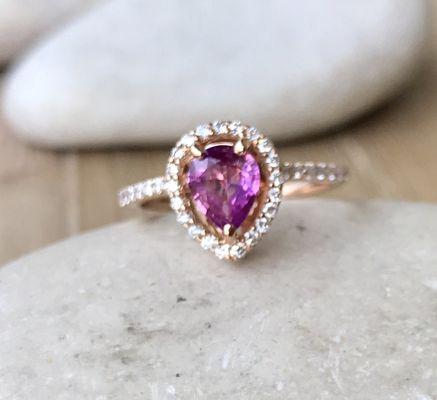 Swoon her with a vivid pink sapphire halo rose gold ring!
