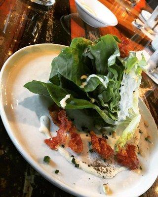 Our Boston Bibb salad, with house made blue cheese dressing, crispy pork belly and pine nuts.