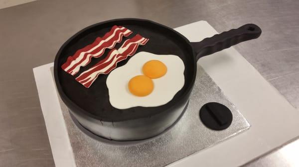 Yes, this is a cake! Eggs and bacon in a skillet.