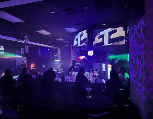 Bottle girls on their phones ignoring customers