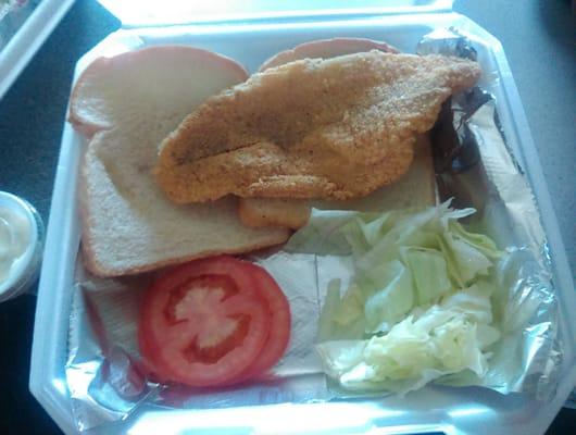 This is what they call a catfish sandwich. Two slices of sandwich bread and lettuce and tomato. SANDWICH BREAD.