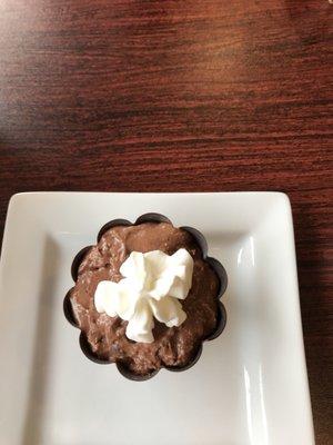 Chocolate mousse with Amarena cherries and white chocolate spiders.