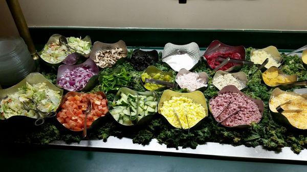 Well stocked salad bar including seafood salad, ham, tuna salad, beets and more.
