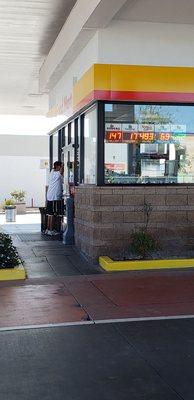 Waiting to get gas because the employee is at Moneytree at now, 920am. So pitiful!!