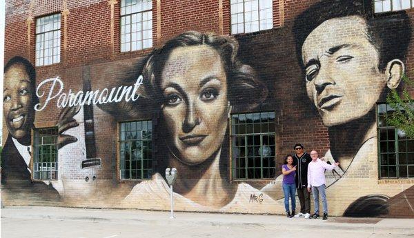 NOIR owners George and Theresa with Mr. G in front of the Paramount OKC.