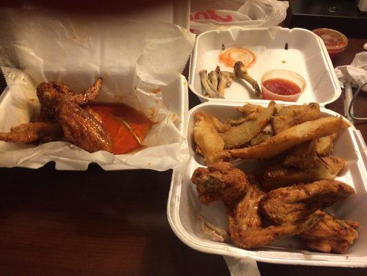 Two four piece chicken wings and fries with the sauce.