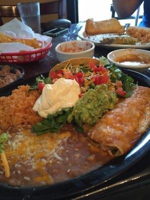 Macho combo #1 with 2 ground beef tacos and a chicken enchilada, with beans and rice. Good!