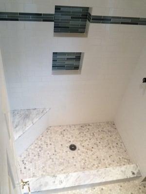 Custom tile shower with cubby and bench seat