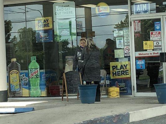 Clerk more interested in chatting than customers