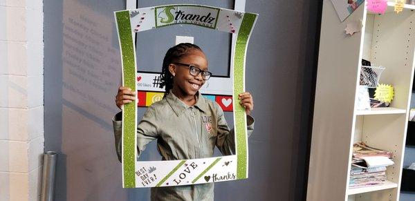 My granddaughter happy with her style at Strandz Hair Lounge!