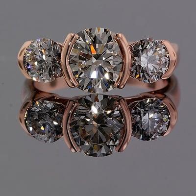 An example of our work, a beautiful rose gold three stone ring.