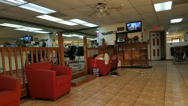 Interior shot with chairs, T.V. & magazines.