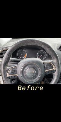 Built up grime on a leather steering wheel