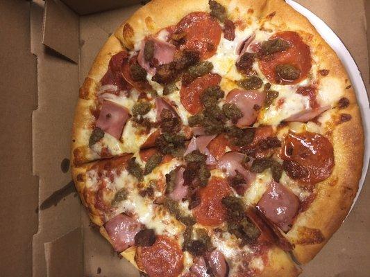 Try our Meat Lovers specialty pizza. We have five other specialty pizzas to choose from.