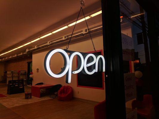 A cool picture of our open sign after dark. We're open until 9 pm Wednesday through Friday!